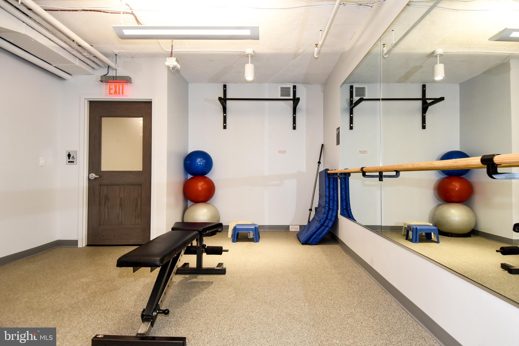 1250 South Washington Street, Unit 816 Alexandria, VA 22314 - Photo 51 of 58 a view of gym equipment with windows