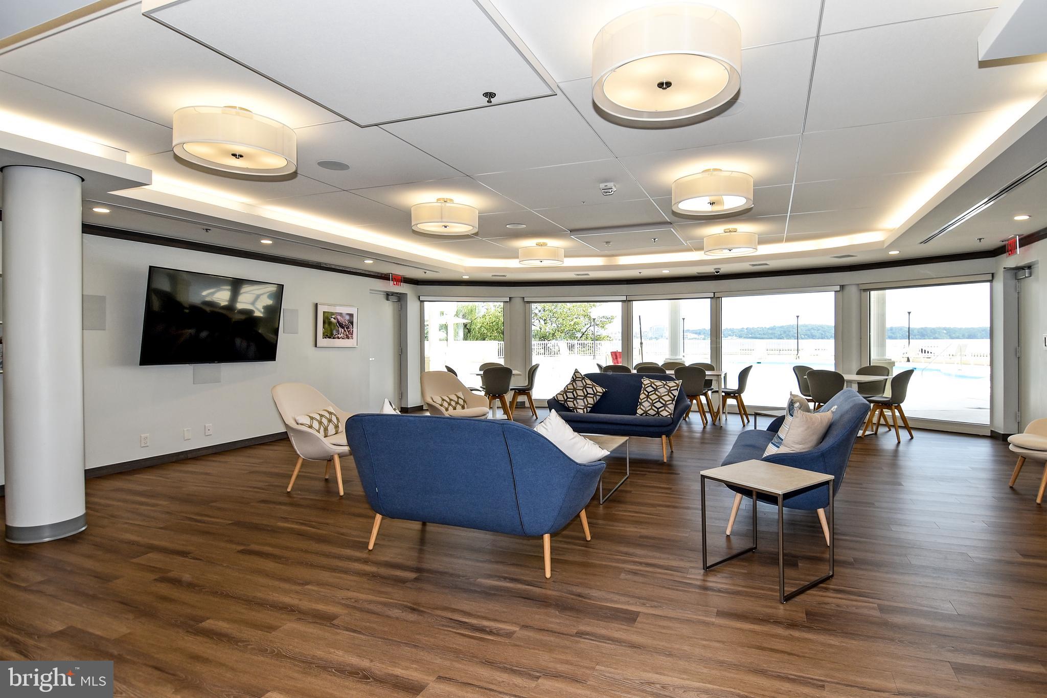 1250 South Washington Street, Unit 816 Alexandria, VA 22314 - Photo 52 of 58 a living room with furniture and a large window