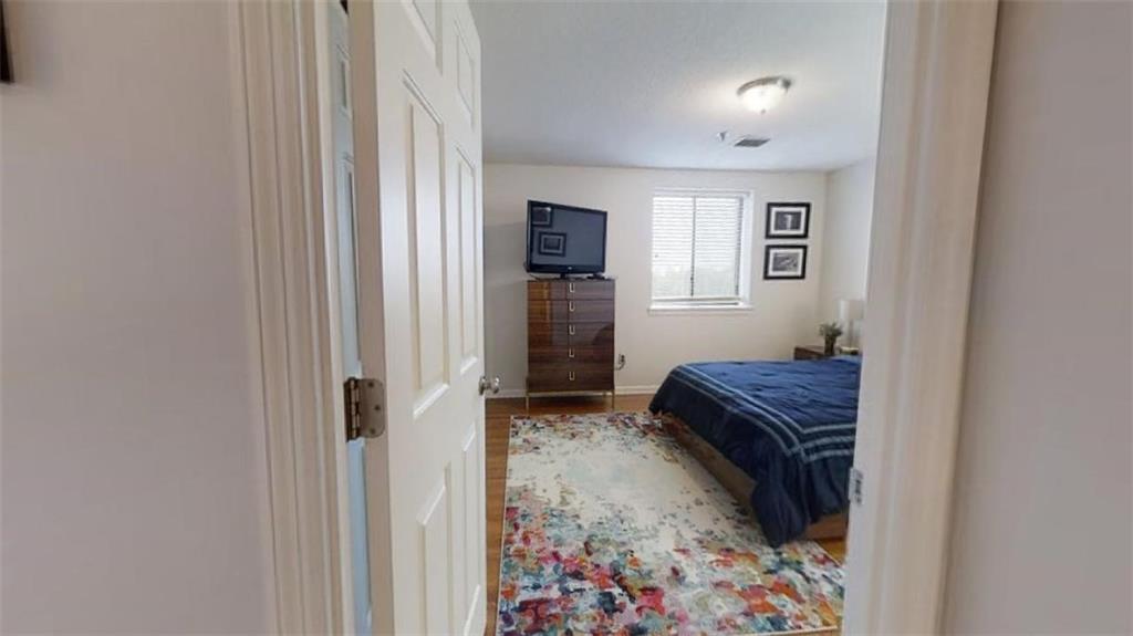 300 Johnson Ferry Road, Unit B605 Atlanta, GA 30328 - Photo 24 of 33 a bedroom with a bed and a window