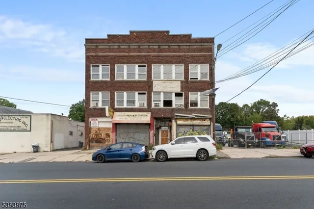 a view of a cars park in front of a building