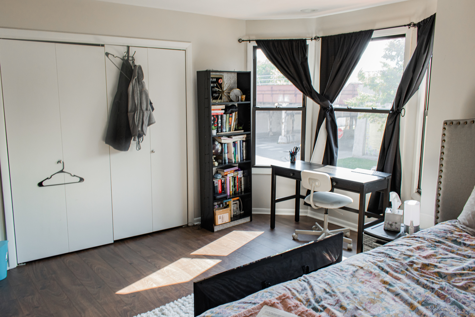 440 North Racine Avenue, Unit 2 Chicago, IL 60642 - Photo 11 of 20 a bedroom with a bed a mirror and a window