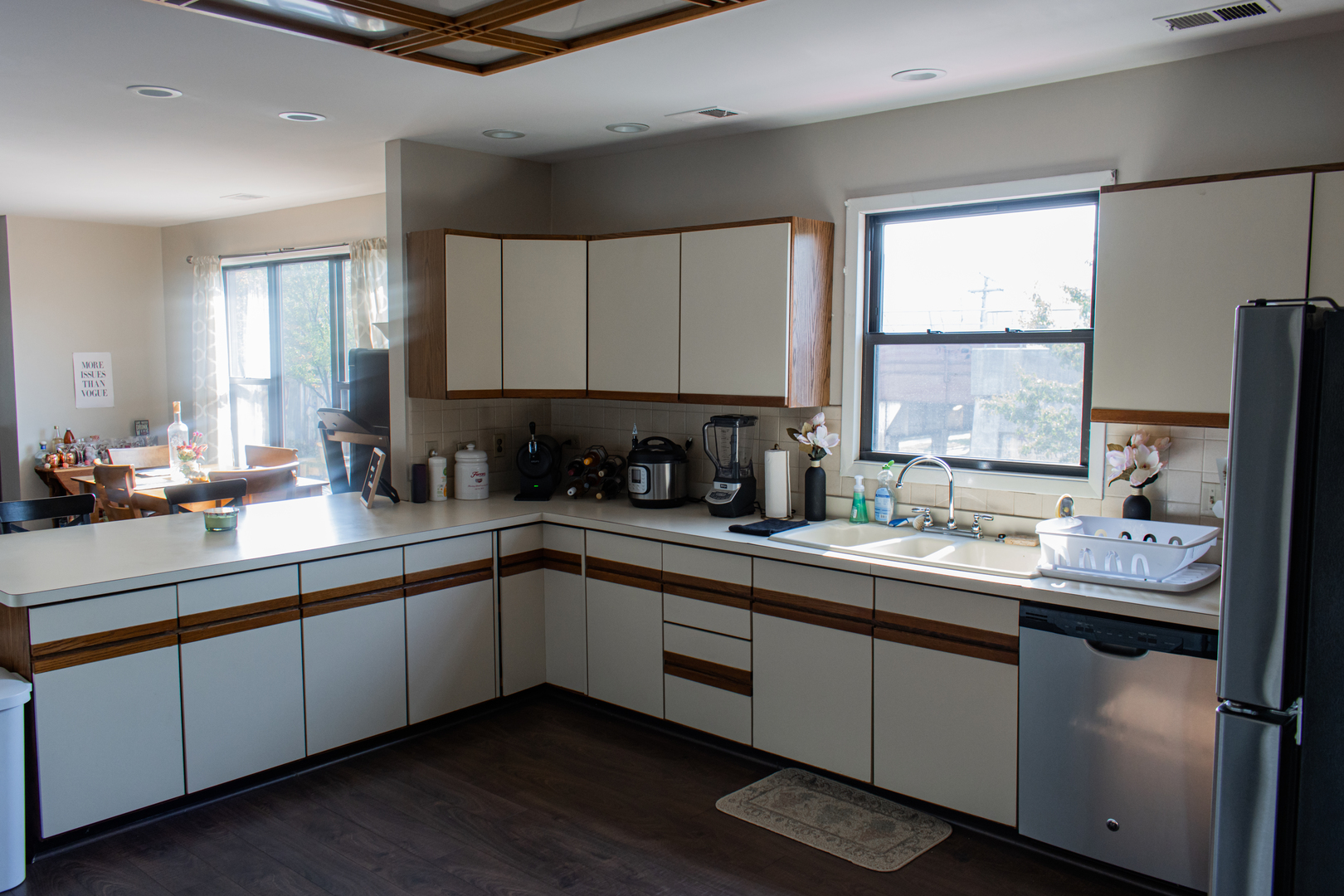 440 North Racine Avenue, Unit 2 Chicago, IL 60642 - Photo 5 of 20 a kitchen with a sink window and cabinets