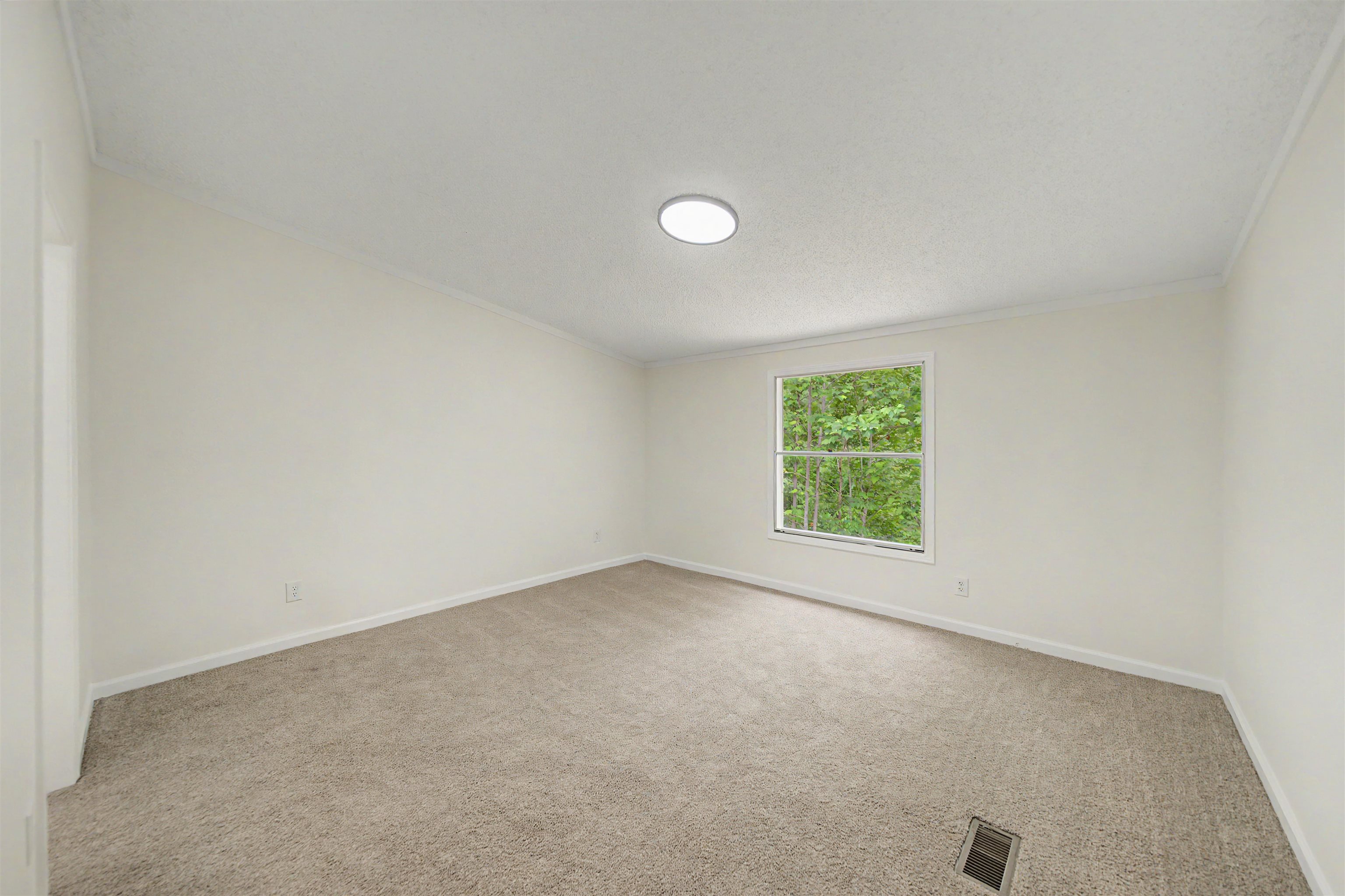 890 Burks Road Savannah, TN 38372 - Photo 13 of 40 an empty room with a window