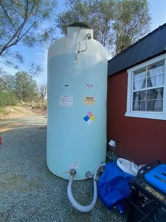 a view of a house with backyard space
