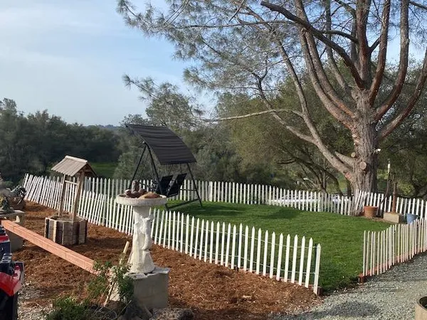 a view of a wrought iron fences in front of house