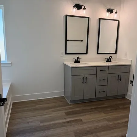a view of bathroom with dual sinks
