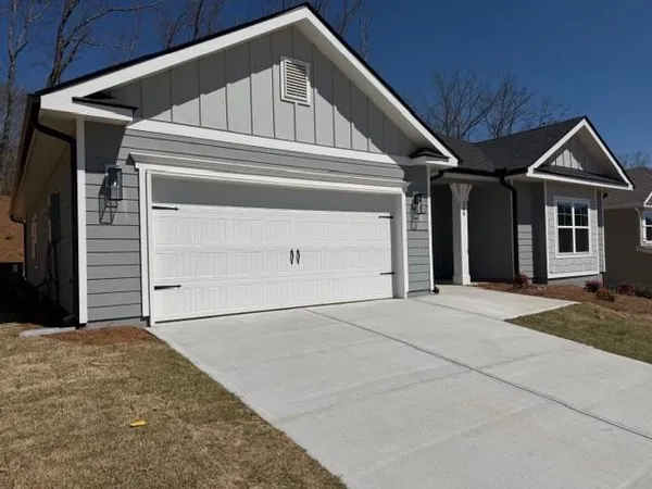 a view of house with garage