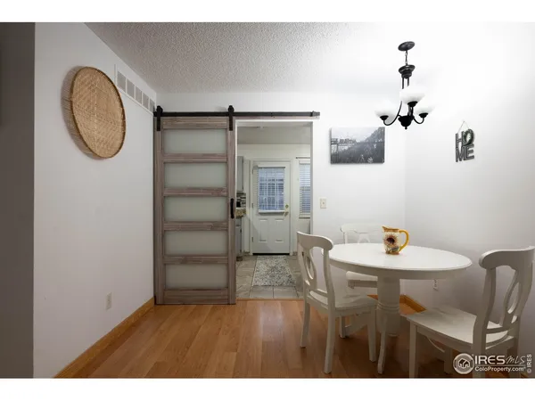 a kitchen with a refrigerator and a sink