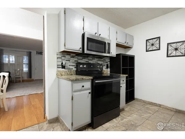 a kitchen with a sink stove and refrigerator