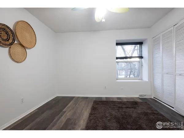 a view of room with wooden floor