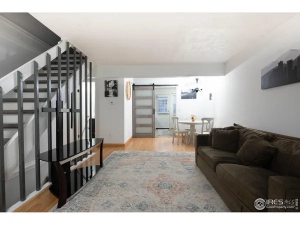 a kitchen with a refrigerator and a sink