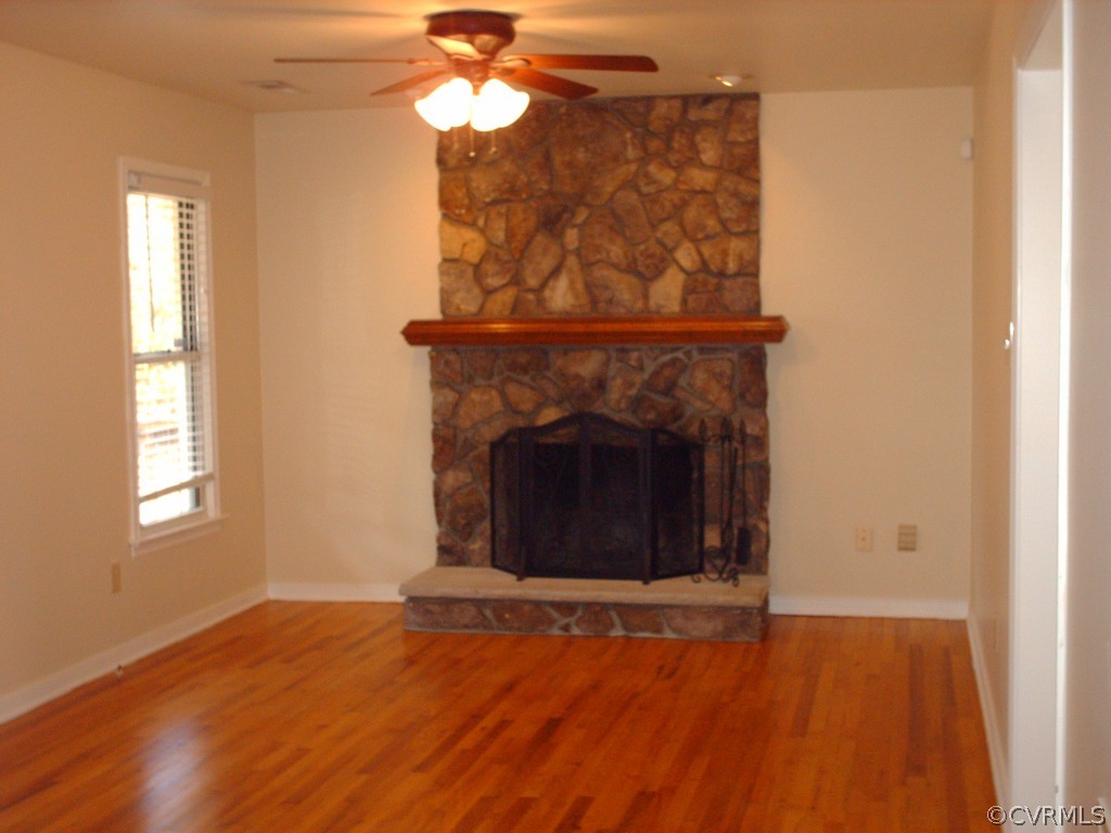 3560 Hemlock Road Chester, VA 23831 - Photo 4 of 16 a view of a livingroom with a fireplace and window