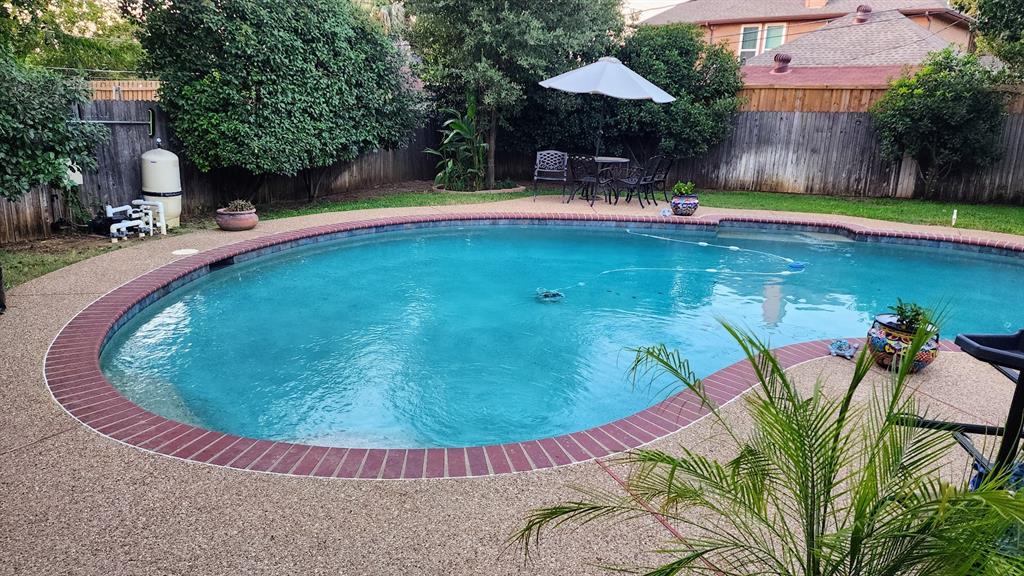 7505 Patsy Court Arlington, TX 76016 - Photo 2 of 38 View of swimming pool featuring a fenced backyard and a patio.