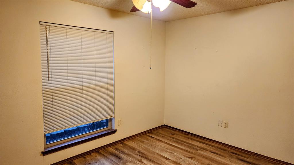7505 Patsy Court Arlington, TX 76016 - Photo 24 of 38 Bedroom with light wood-style floors and baseboards.
