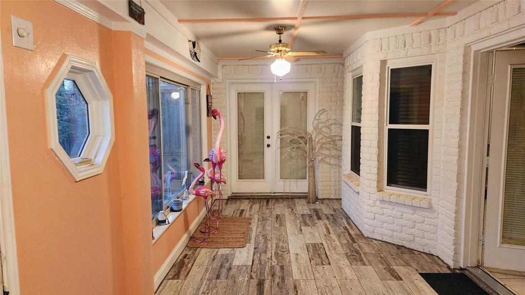 7505 Patsy Court Arlington, TX 76016 - Photo 28 of 38 Sun room with ceiling fan, and french doors.