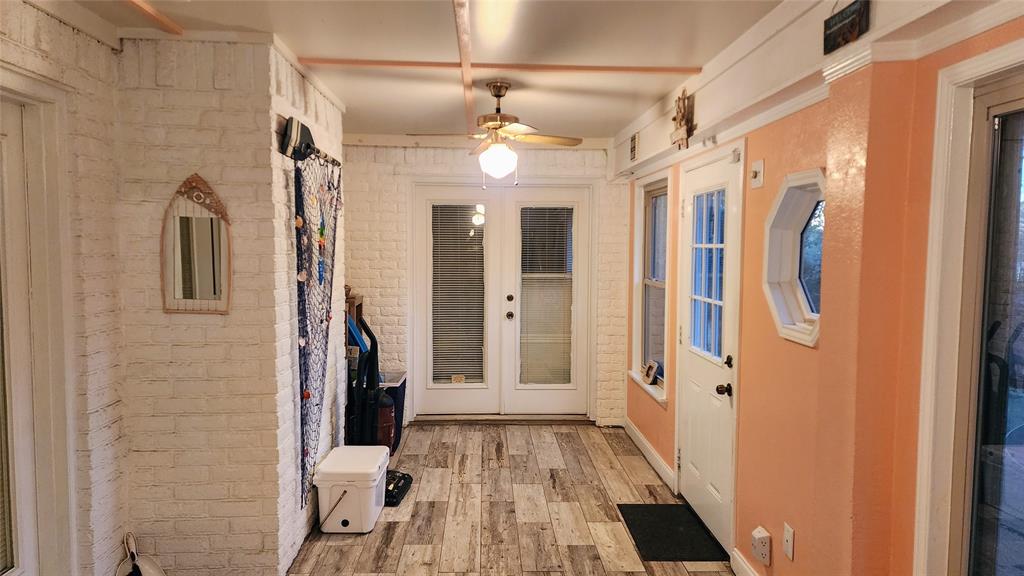 7505 Patsy Court Arlington, TX 76016 - Photo 29 of 38 Sun room with ceiling fan, and french doors.