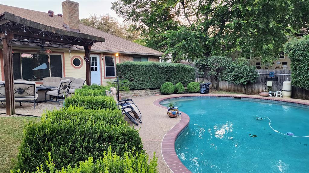 7505 Patsy Court Arlington, TX 76016 - Photo 32 of 38 View of swimming pool featuring a patio, a fenced backyard, outdoor lounge area, and a pergola.