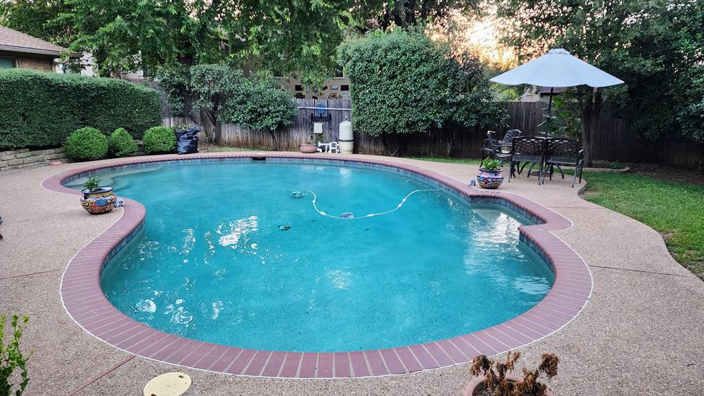7505 Patsy Court Arlington, TX 76016 - Photo 33 of 38 View of swimming pool featuring a fenced backyard and a patio area.