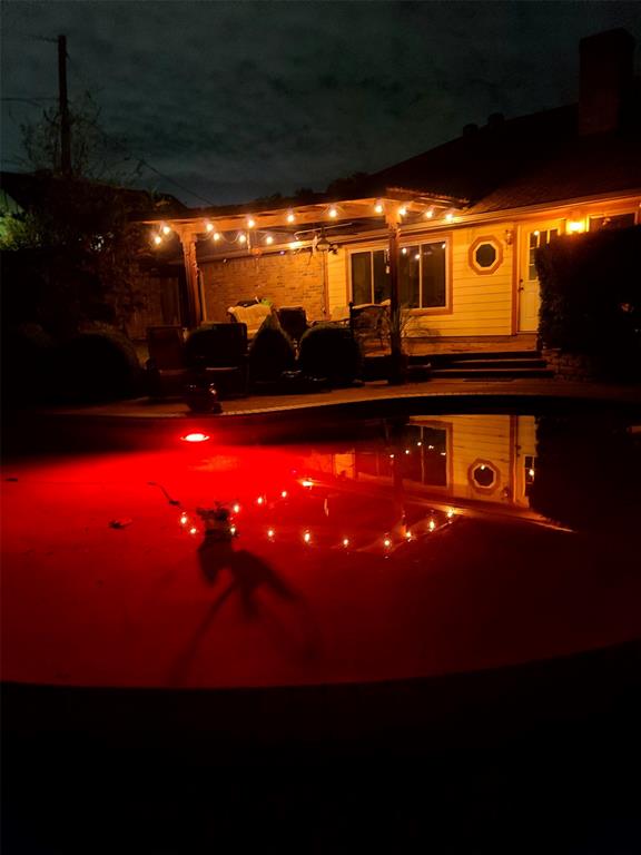 7505 Patsy Court Arlington, TX 76016 - Photo 34 of 38 Pool at twilight with an outdoor pool. Colors can be changed.