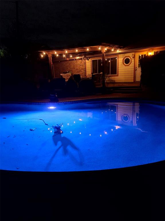 7505 Patsy Court Arlington, TX 76016 - Photo 35 of 38 Pool at twilight with an outdoor pool. Colors can be changed.