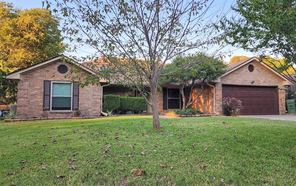 7505 Patsy Court Arlington, TX 76016 - Photo 4 of 38 Single story home with a front lawn, brick siding, and driveway.