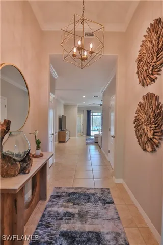 a view of a kitchen with a sink and a chandelier