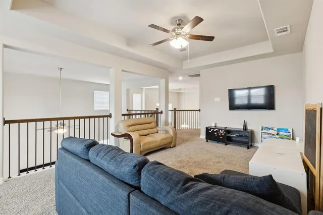 a spacious bedroom with a bed and furniture