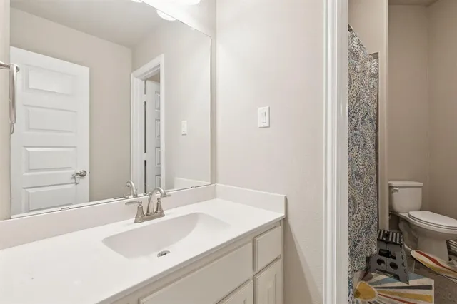 a bathroom with a sink and a toilet