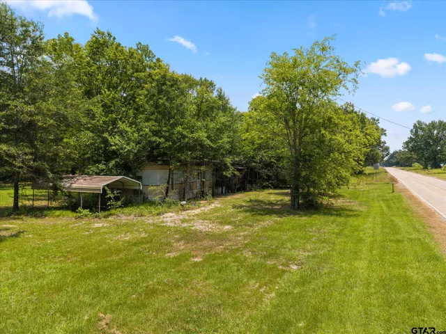 a view of a house with a garden