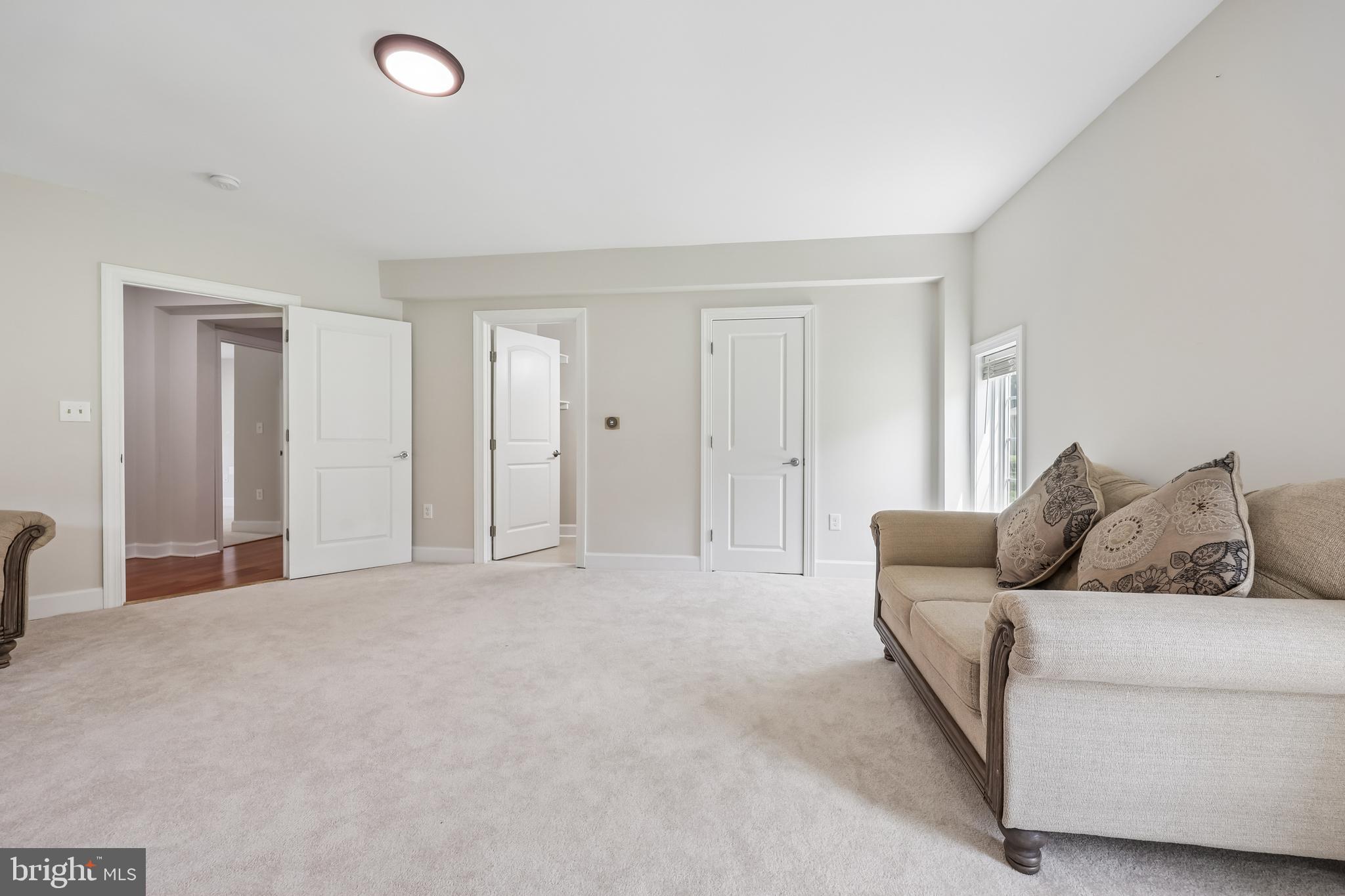 12304 Popes Head Road Fairfax, VA 22030 - Photo 58 of 78 a living room with furniture and a couch