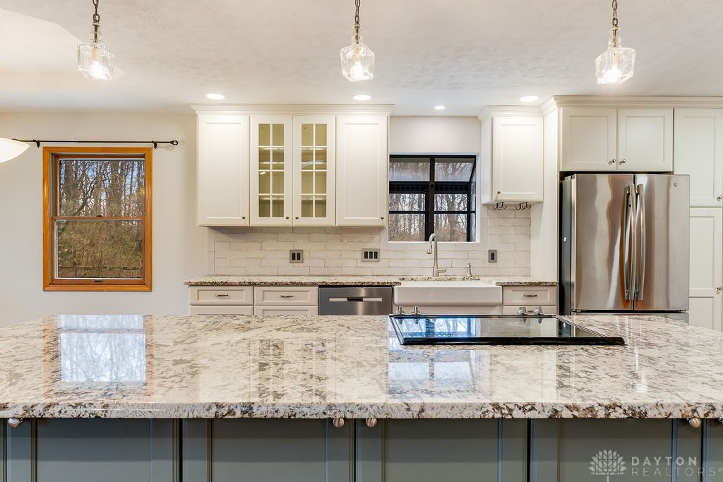 7400 Cook-Jones Road Waynesville, OH 45068 - Photo 36 of 72 This kitchen features a spacious island, elegant countertops, and contemporary appliances.