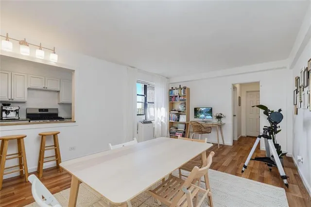 a bed room with a bed and a chair