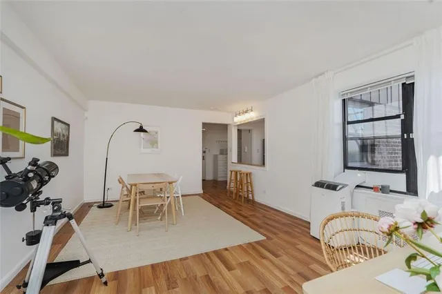 a view of a livingroom with furniture and bedroom