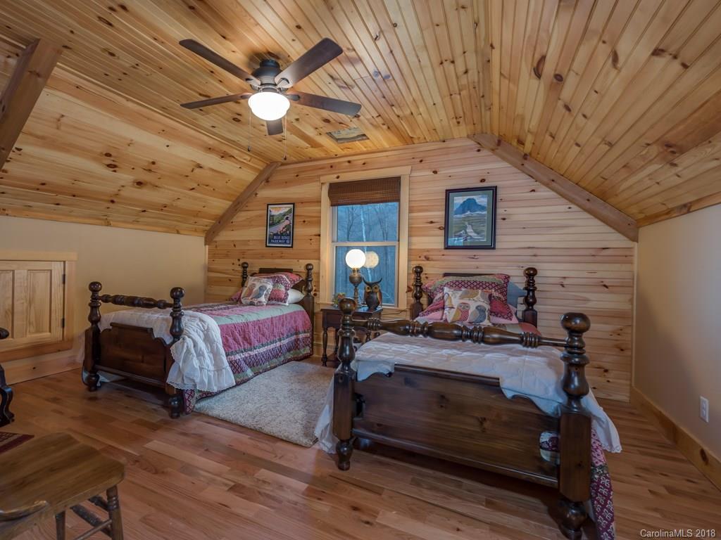 2189 Judes Gap Road Mill Spring, NC 28756 - Photo 12 of 22 a living room with furniture and wooden floor