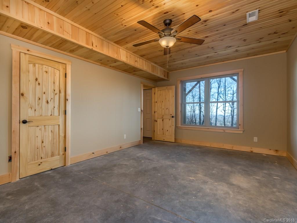 2189 Judes Gap Road Mill Spring, NC 28756 - Photo 17 of 22 an empty room with windows