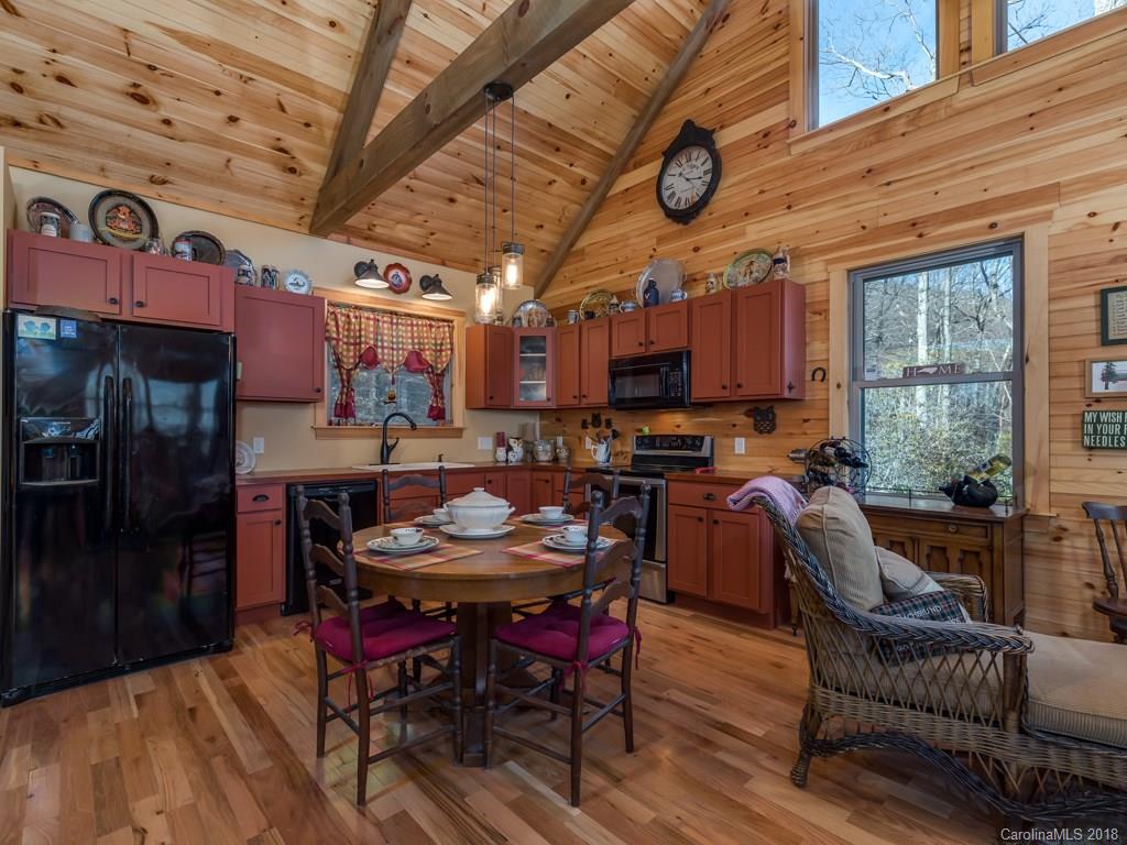 2189 Judes Gap Road Mill Spring, NC 28756 - Photo 3 of 22 a view of a dining room with furniture window and outside view