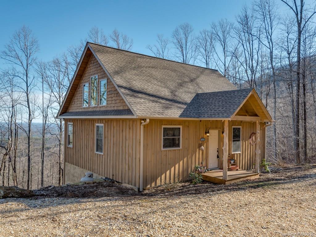 2189 Judes Gap Road Mill Spring, NC 28756 - Photo 21 of 22 a front view of a house with a yard