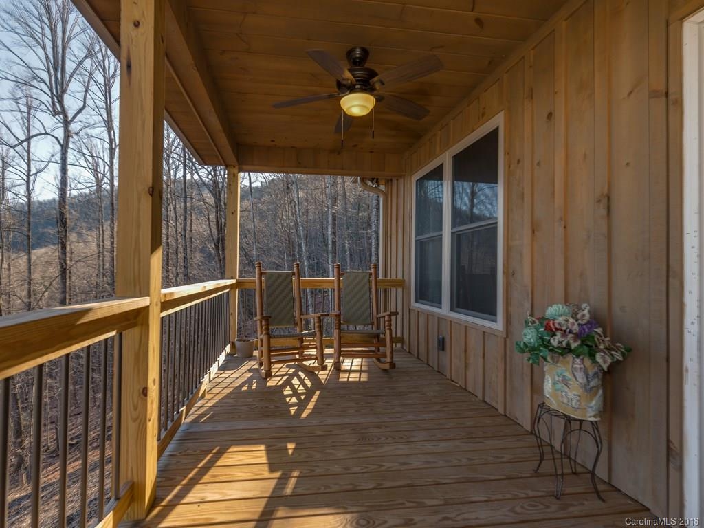 2189 Judes Gap Road Mill Spring, NC 28756 - Photo 8 of 22 a view of a balcony with chairs