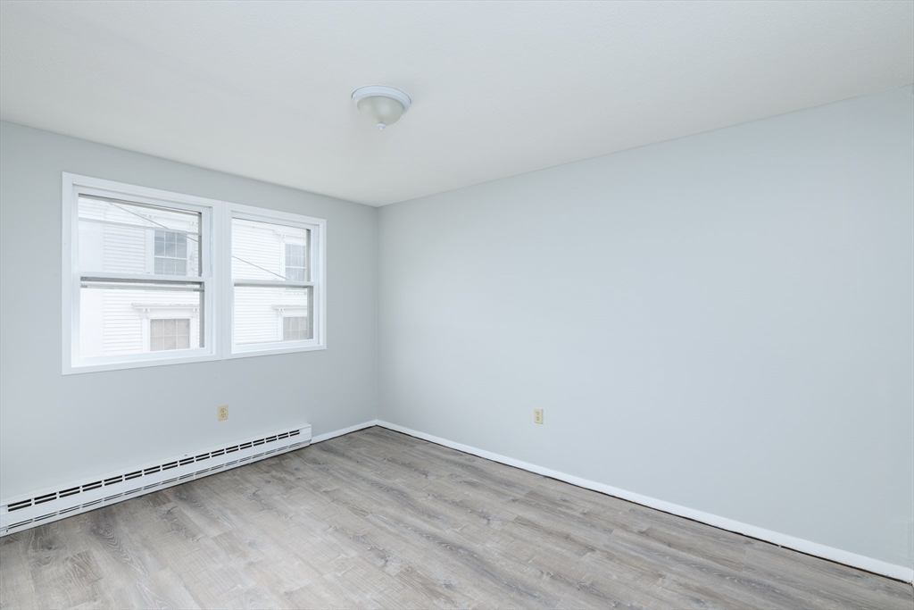 504 Main Street Sturbridge, MA 01518 - Photo 11 of 25 an empty room with a window