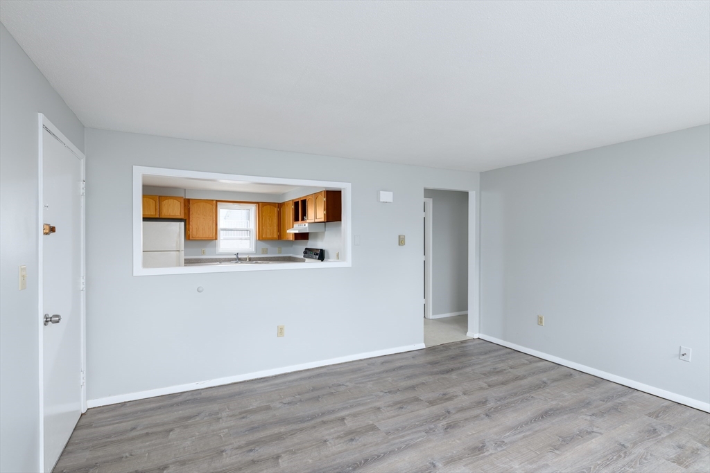 504 Main Street Sturbridge, MA 01518 - Photo 13 of 25 a view of a livingroom with wooden floor and a window