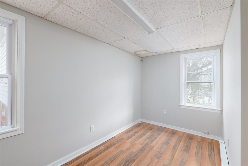 504 Main Street Sturbridge, MA 01518 - Photo 19 of 25 an empty room with a window