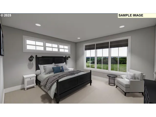 a living room with a bed furniture and a large window