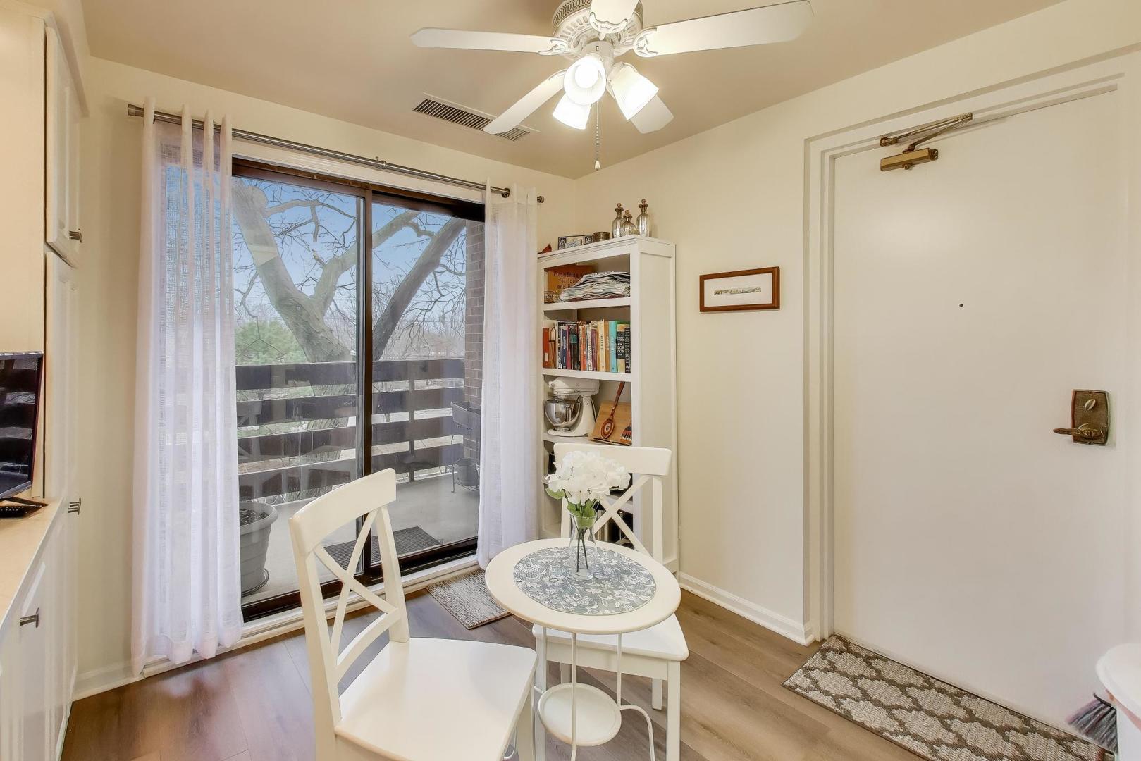 2020 Chestnut Avenue, Unit 312 Glenview, IL 60025 - Photo 12 of 34 a living room with furniture and a window