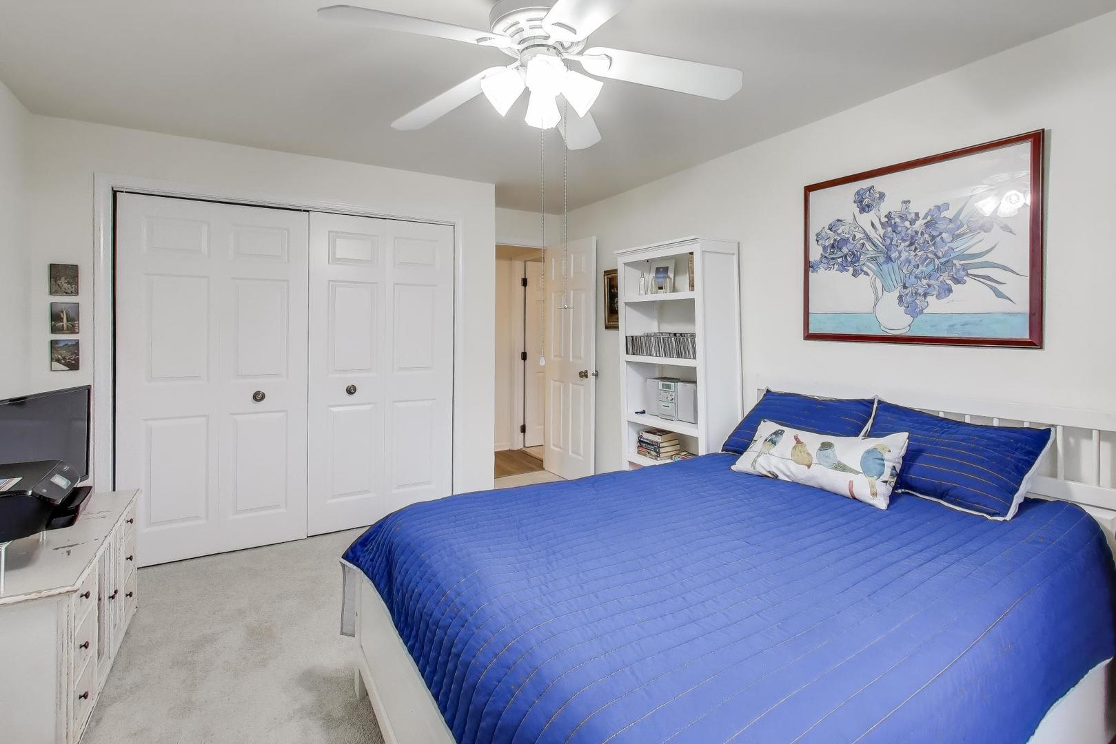 2020 Chestnut Avenue, Unit 312 Glenview, IL 60025 - Photo 19 of 34 a bedroom with a large bed and a chandelier