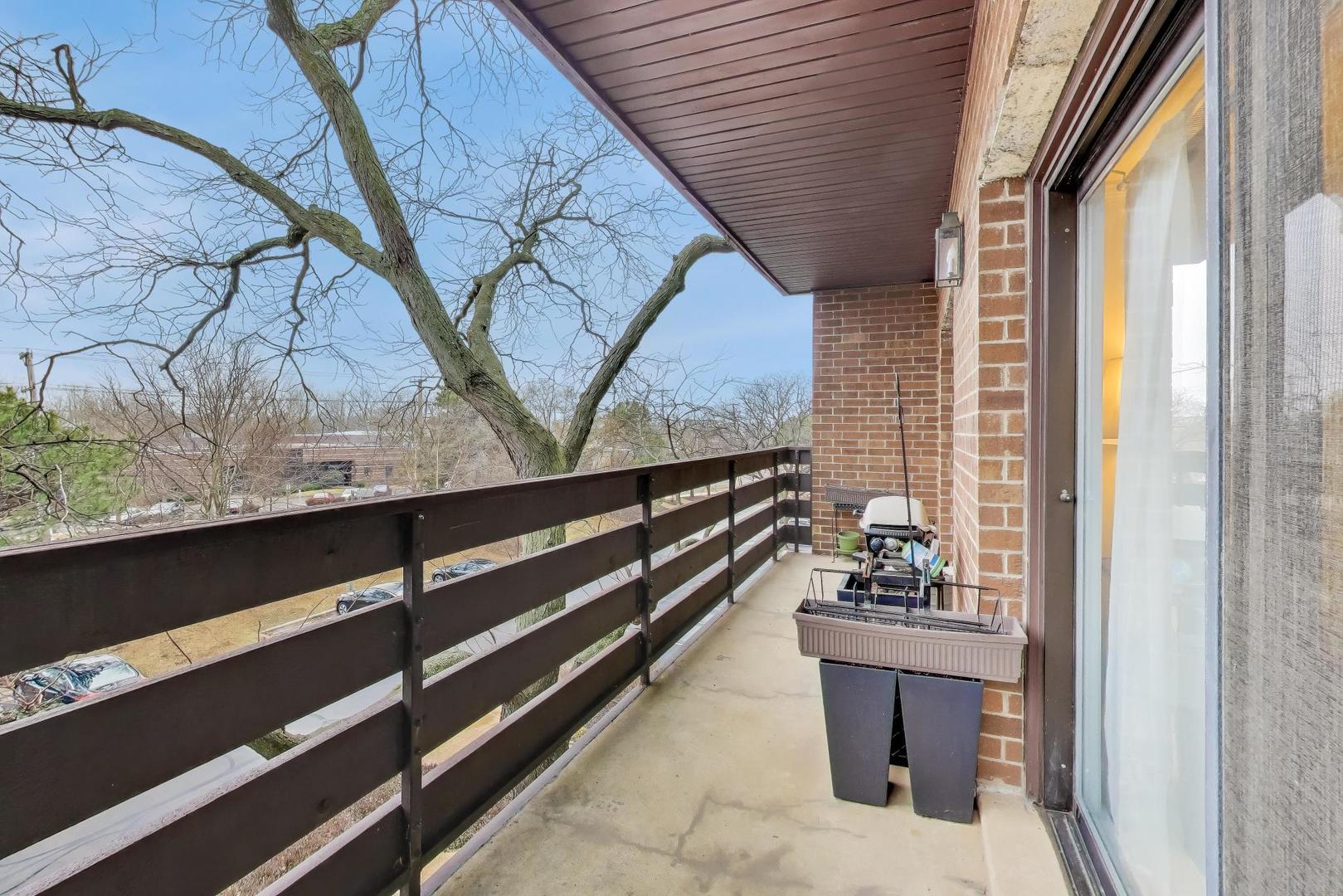 2020 Chestnut Avenue, Unit 312 Glenview, IL 60025 - Photo 21 of 34 a view of two chairs and table in the balcony