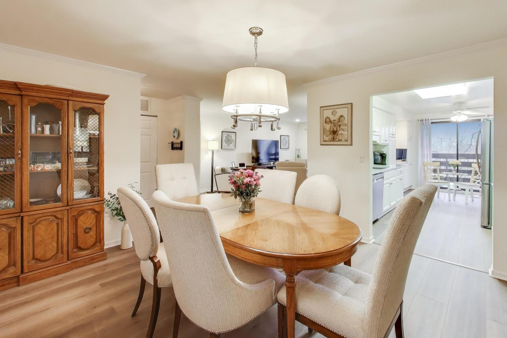 2020 Chestnut Avenue, Unit 312 Glenview, IL 60025 - Photo 9 of 34 a view of a dining room with furniture and wooden floor
