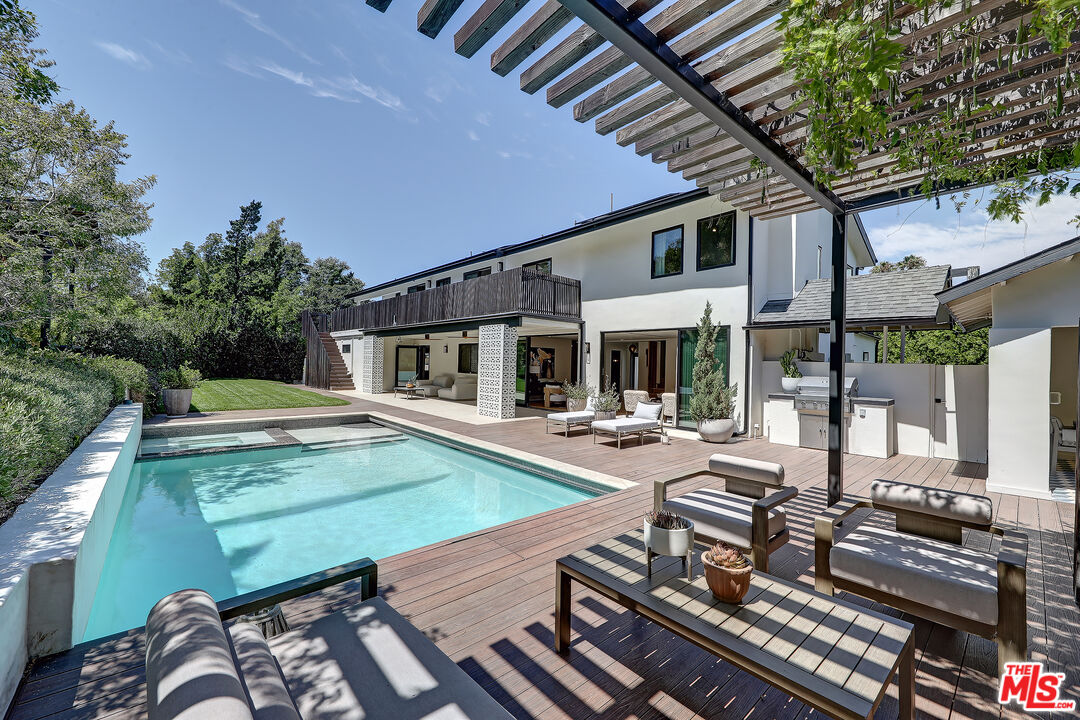 a view of a backyard with sitting area