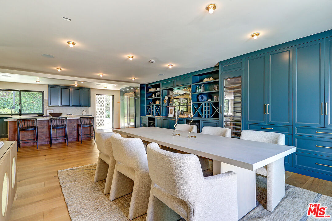 8674 Edwin Drive Los Angeles, CA 90046 - Photo 16 of 53 a dining hall with stainless steel appliances granite countertop a table and chairs