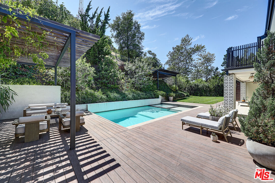 8674 Edwin Drive Los Angeles, CA 90046 - Photo 2 of 53 a view of a chairs and table on the wooden deck