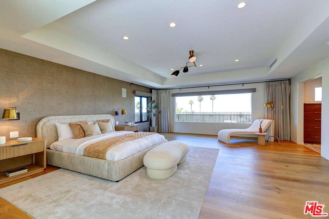 8674 Edwin Drive Los Angeles, CA 90046 - Photo 25 of 53 a bedroom with a bed and a large window